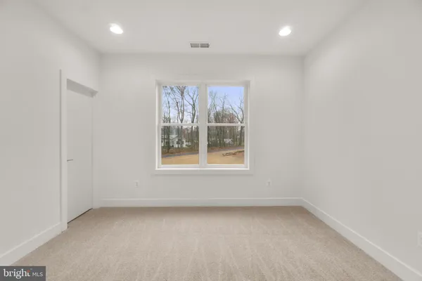 a view of an empty room with stairs