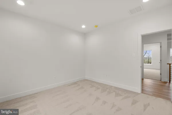 a bathroom with a sink toilet vanity and shower