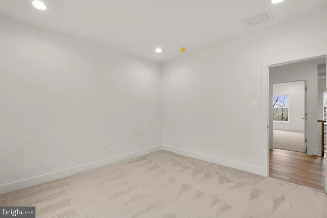 a bathroom with a sink toilet vanity and shower