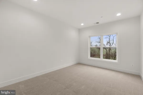 a view of a balcony with wooden floor and fence