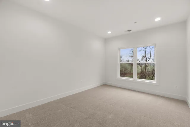 a view of a balcony with wooden floor and fence