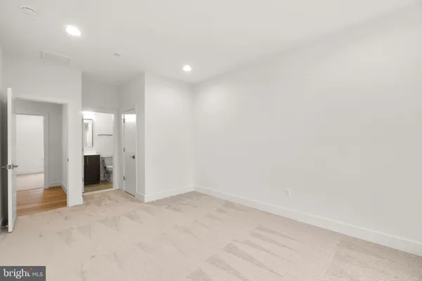 a view of field with trees in the background