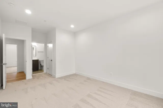 a view of field with trees in the background