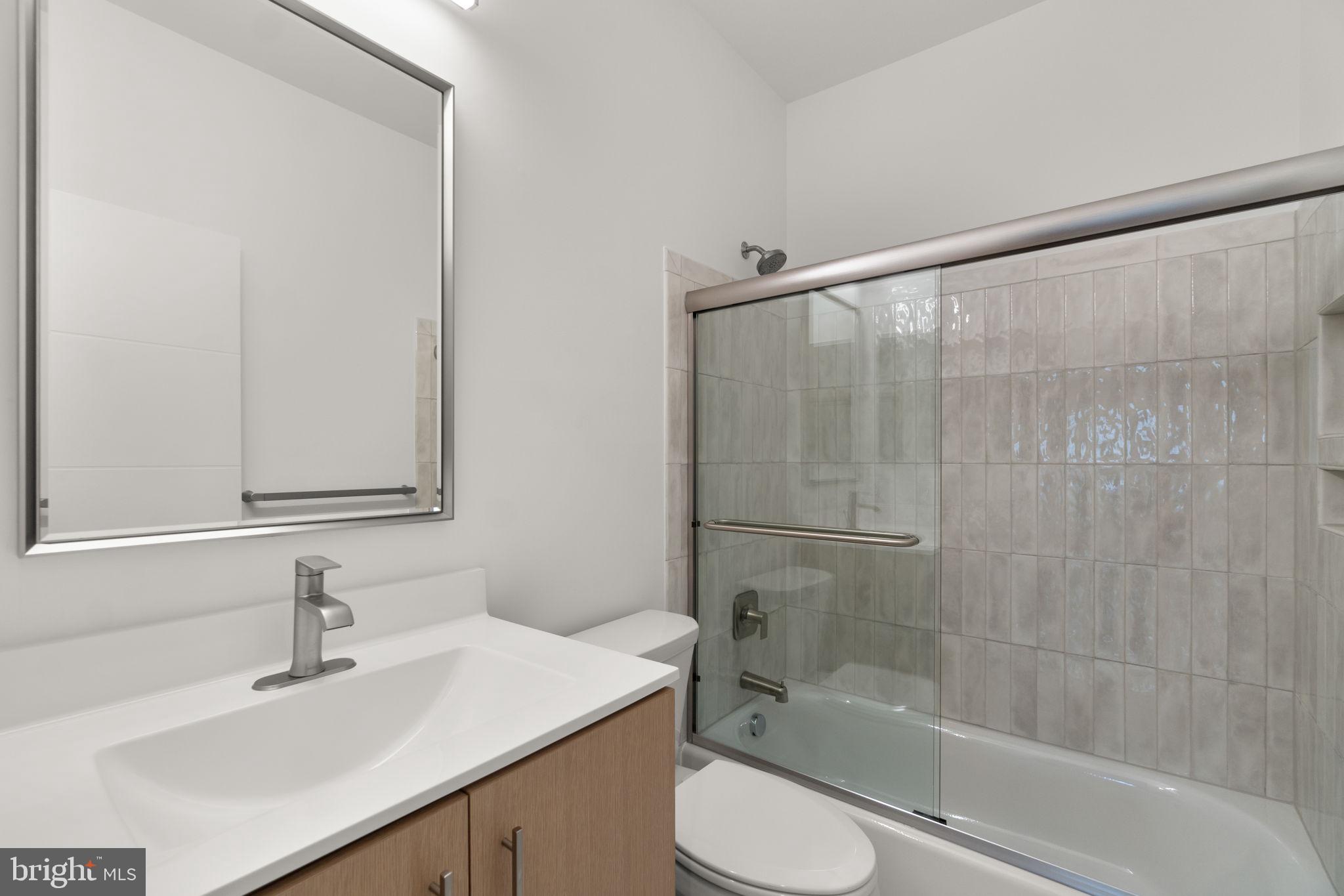 14628 Old Hanover Road, Unit BENTON Reisterstown, MD 21136 - Photo 51 of 69 a bathroom with a sink toilet and shower