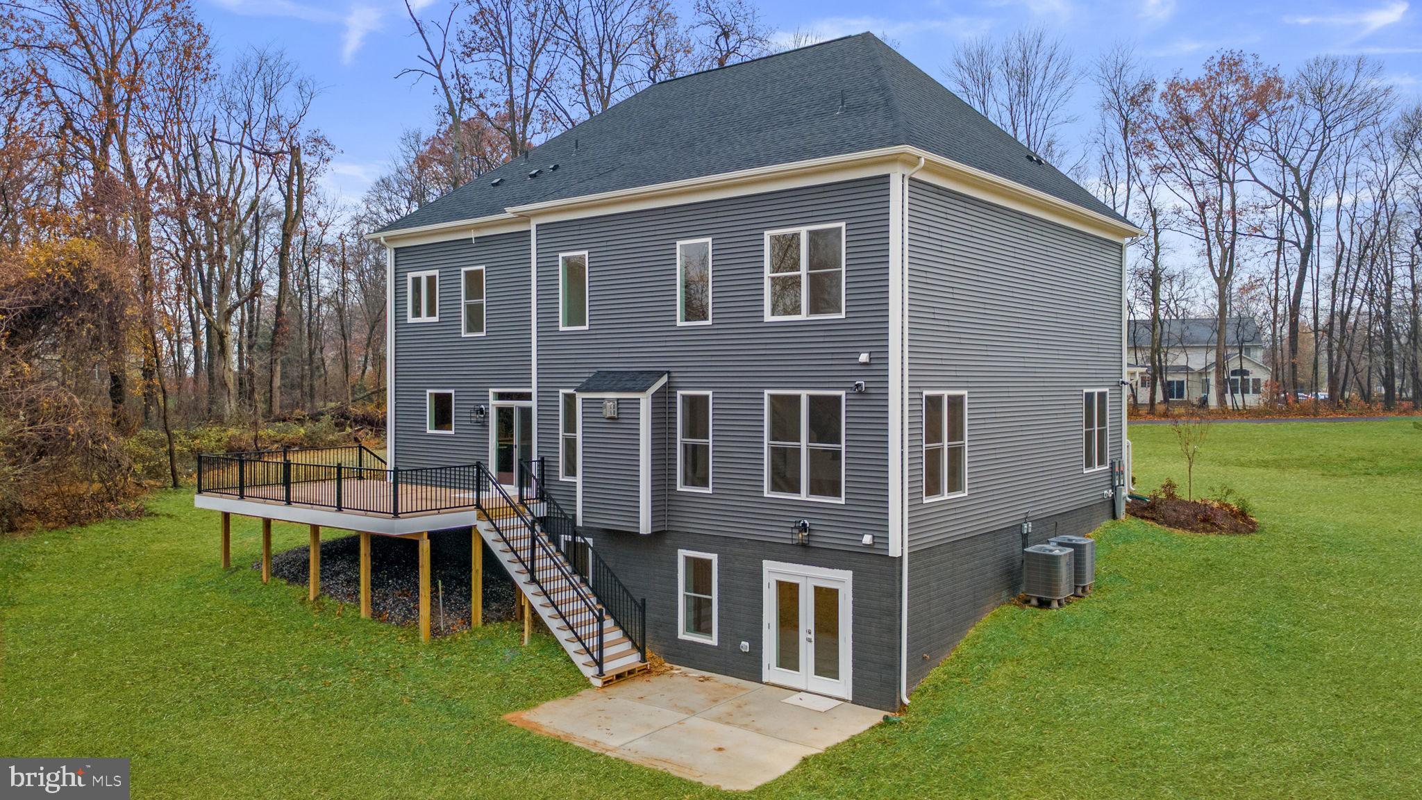 14628 Old Hanover Road, Unit BENTON Reisterstown, MD 21136 - Photo 62 of 69 a front view of a house with garden