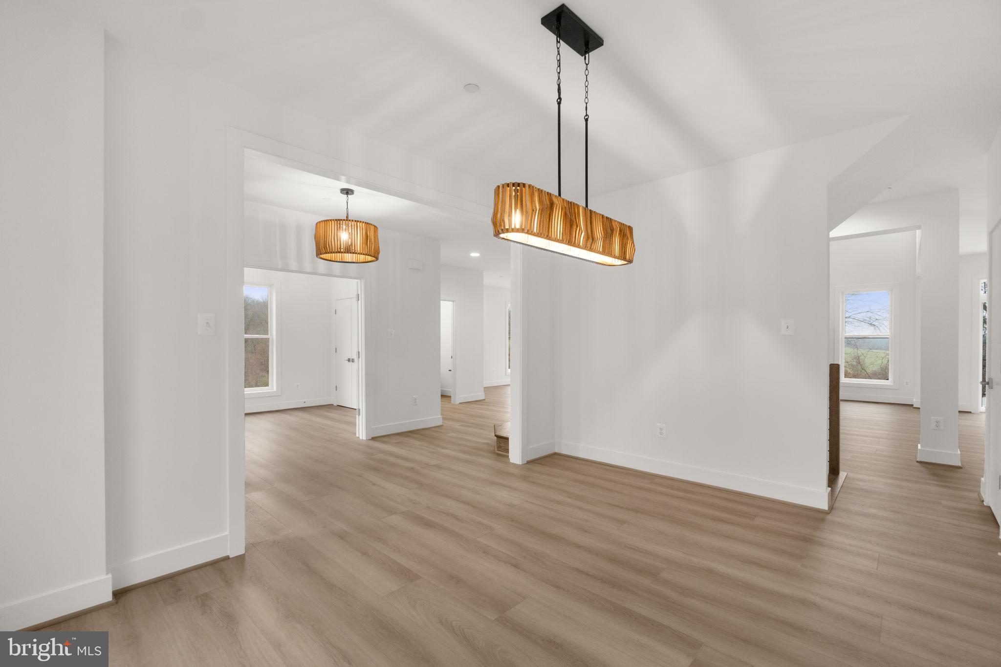 14628 Old Hanover Road, Unit BENTON Reisterstown, MD 21136 - Photo 7 of 69 a view of an empty room and wooden floor