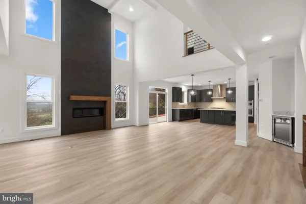 a view of a kitchen with wooden floor and a kitchen