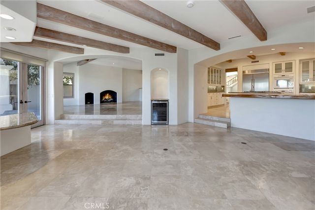 wooden floor in a hall with a large window