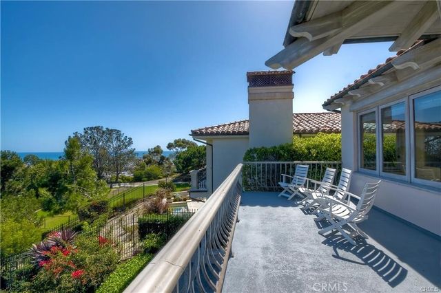 a view of a balcony with chairs