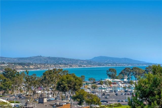 a kitchen that has a sink a stove and a window
