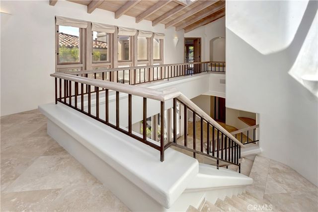 a view of entryway and hall with a living room