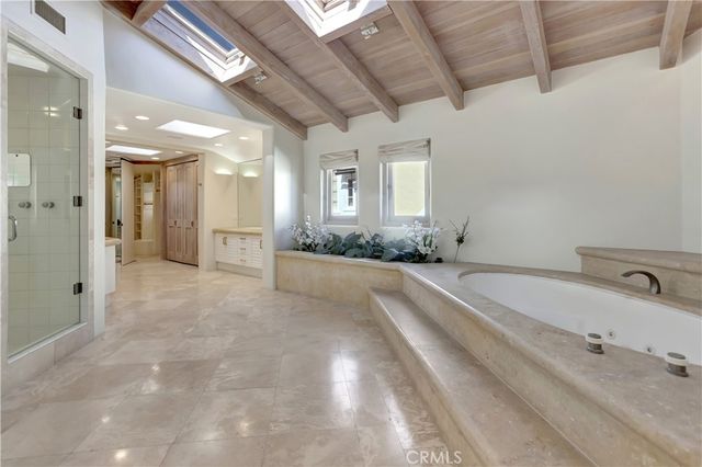 a large bathroom with a double vanity sink shower and a mirror
