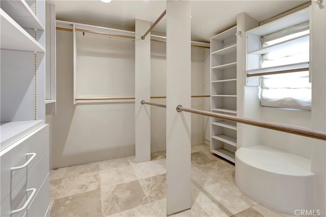 a view of an empty room with large windows