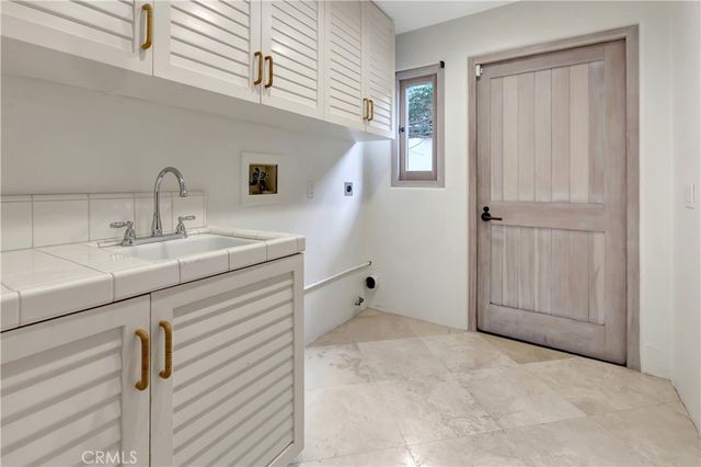a bathroom with a sink mirror vanity and toilet