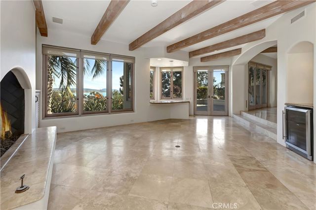 a view of livingroom with furniture flat screen tv and floor to ceiling window