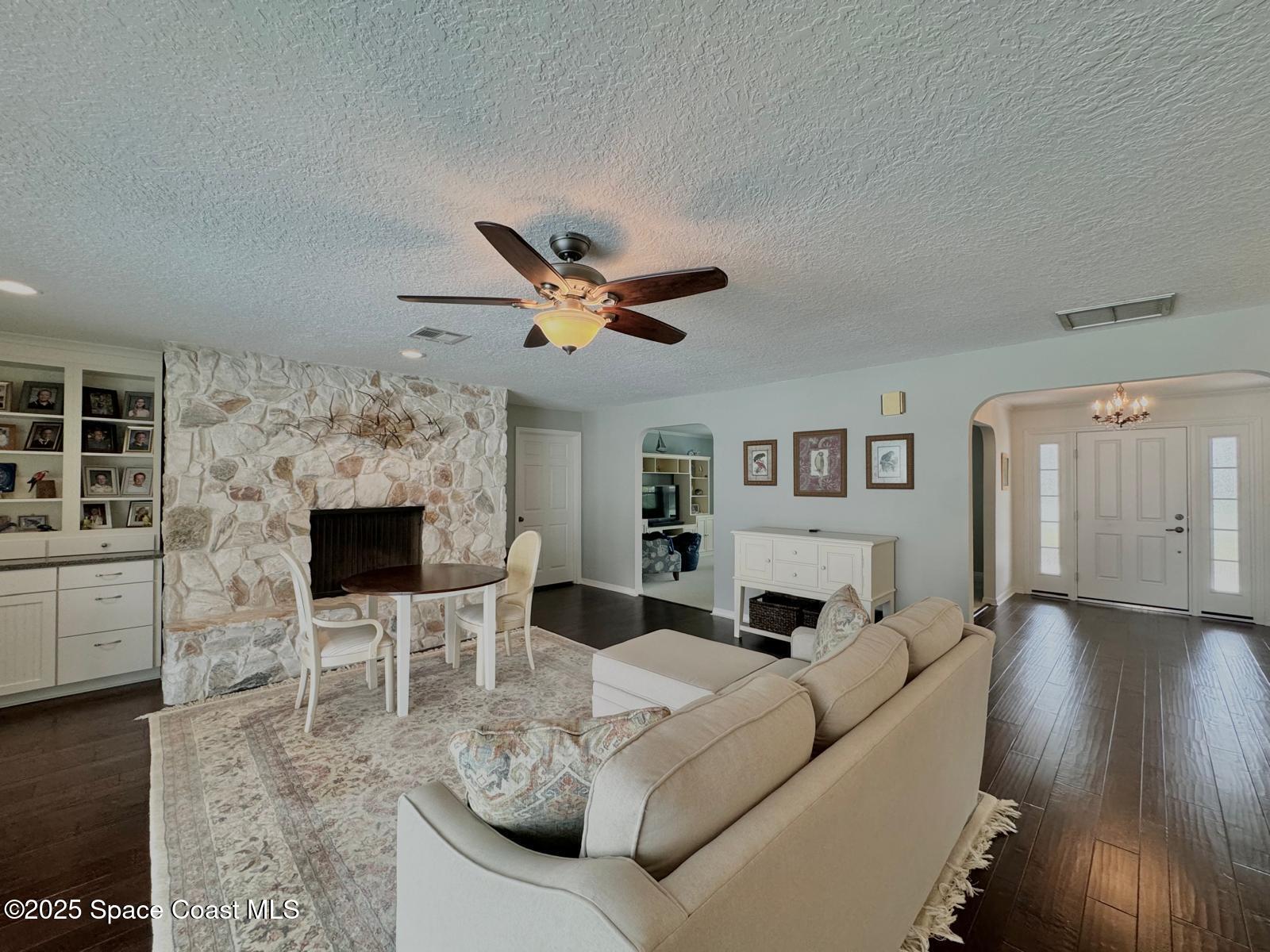 420 Rio Casa Drive North Indialantic, FL 32903 - Photo 22 of 49 a living room with furniture and a fireplace
