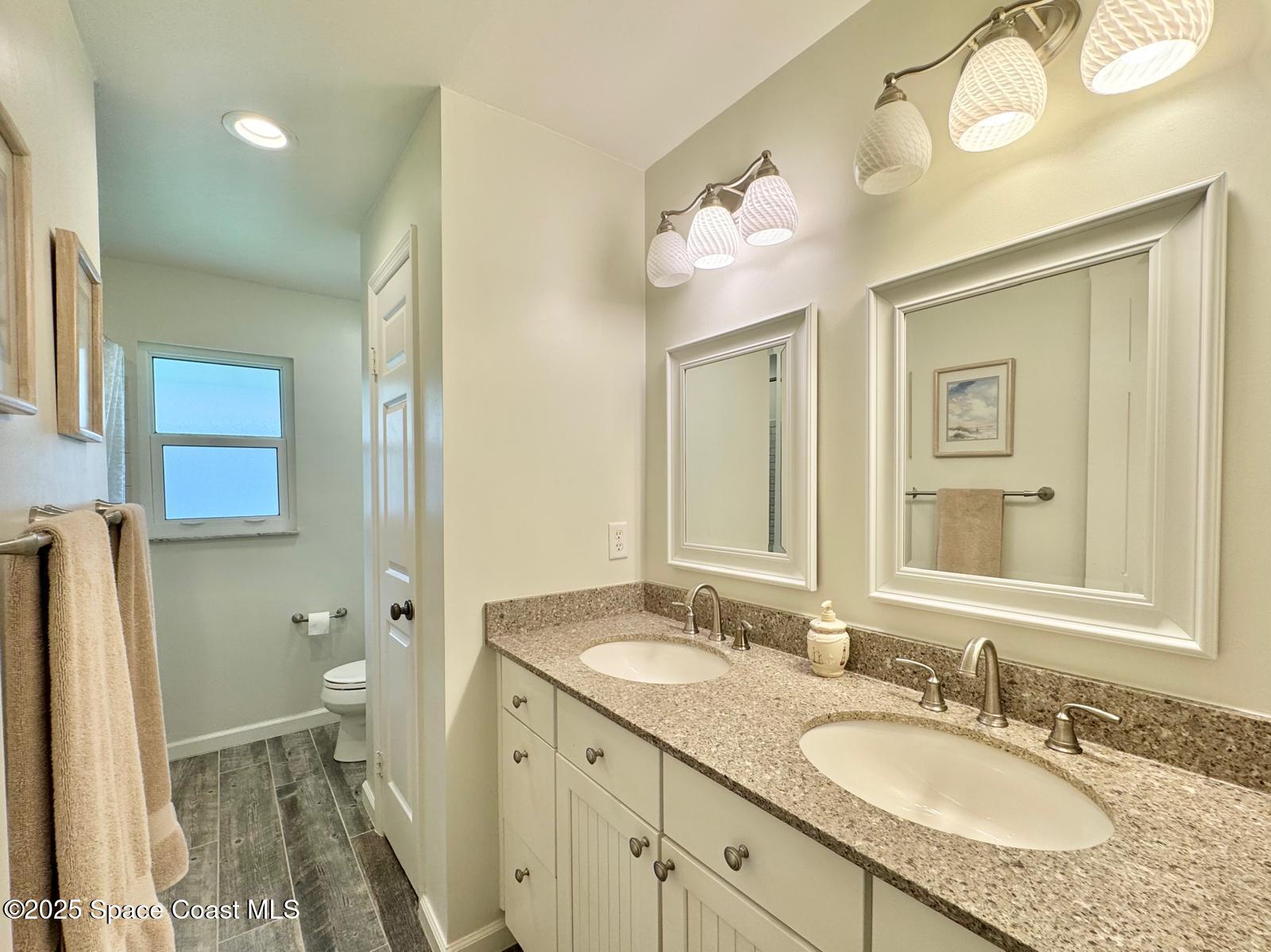 420 Rio Casa Drive North Indialantic, FL 32903 - Photo 27 of 49 a bathroom with a granite countertop sink toilet and shower