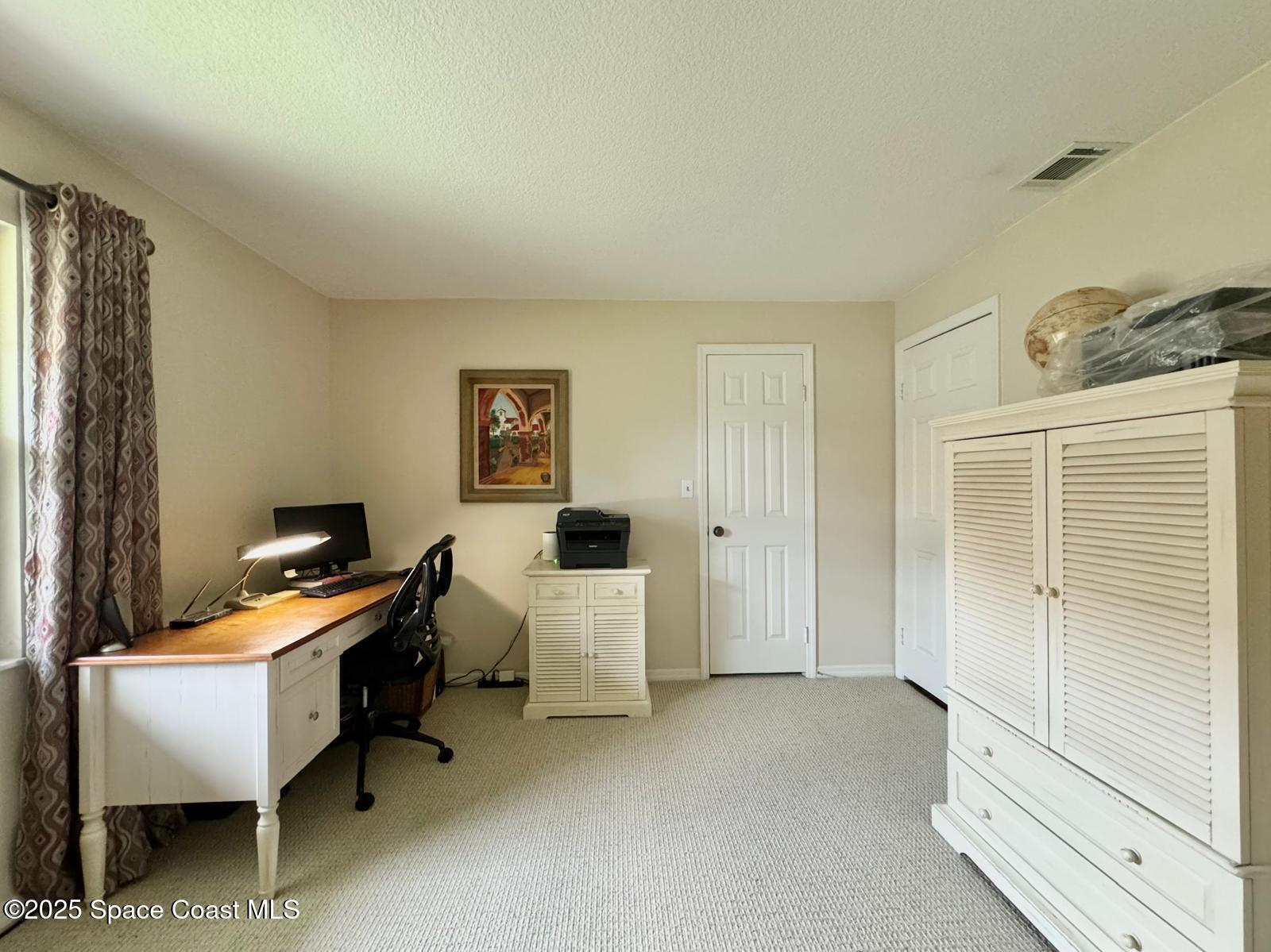 420 Rio Casa Drive North Indialantic, FL 32903 - Photo 29 of 49 a workspace with furniture and window