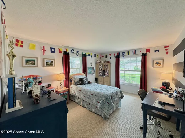 a bedroom with furniture and a bed