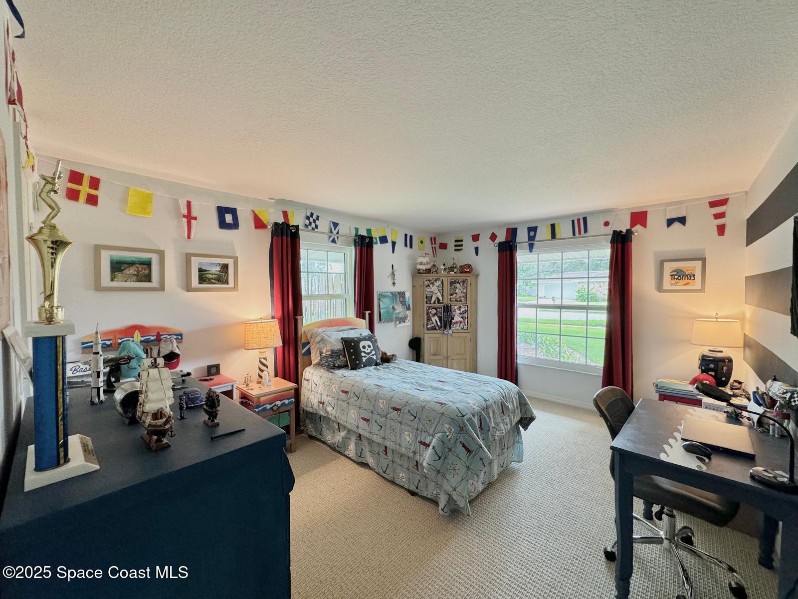 420 Rio Casa Drive North Indialantic, FL 32903 - Photo 30 of 49 a bedroom with furniture and a bed