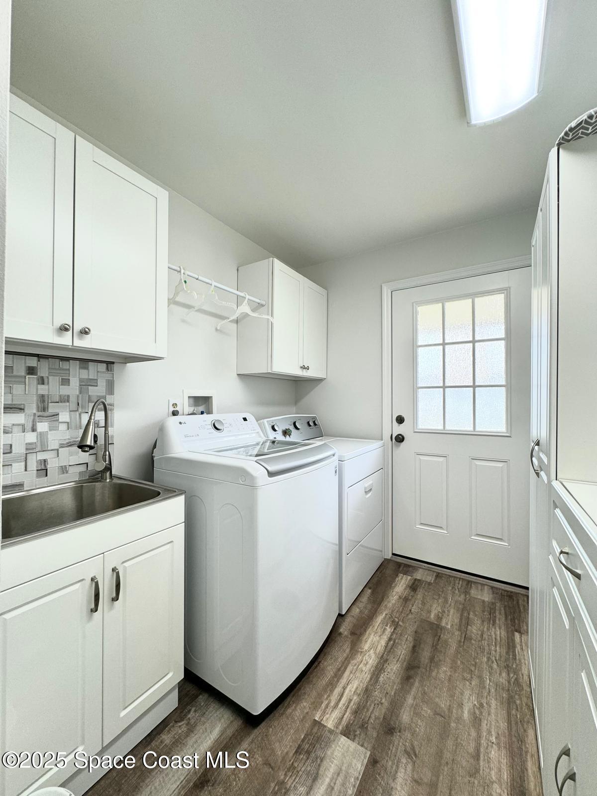 420 Rio Casa Drive North Indialantic, FL 32903 - Photo 34 of 49 a kitchen with white cabinets and white appliances