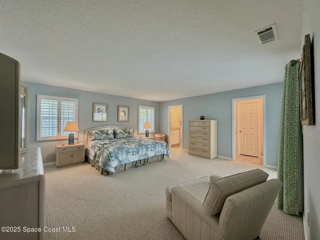 a bedroom with bed and furniture