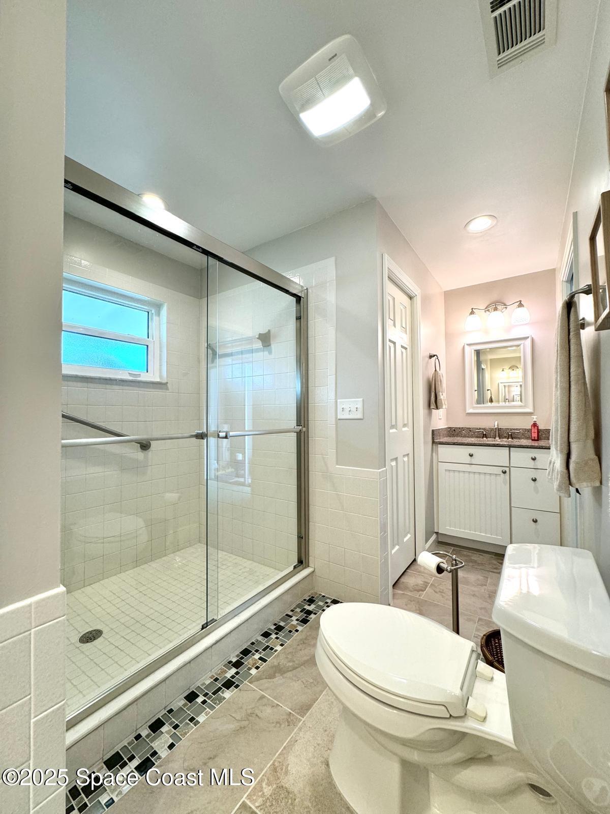 420 Rio Casa Drive North Indialantic, FL 32903 - Photo 40 of 49 a bathroom with a toilet sink and shower