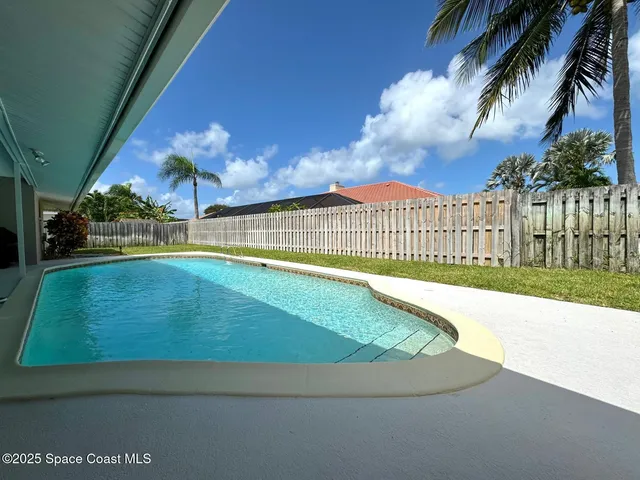 a view of a swimming pool with a garden