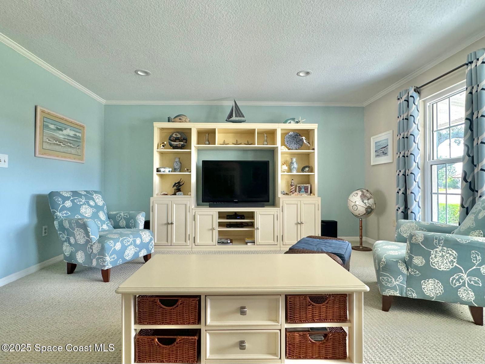 420 Rio Casa Drive North Indialantic, FL 32903 - Photo 10 of 49 a living room with furniture and a flat screen tv