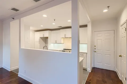 a kitchen with a sink stove and refrigerator