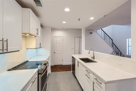 a view of kitchen with wooden floor and window