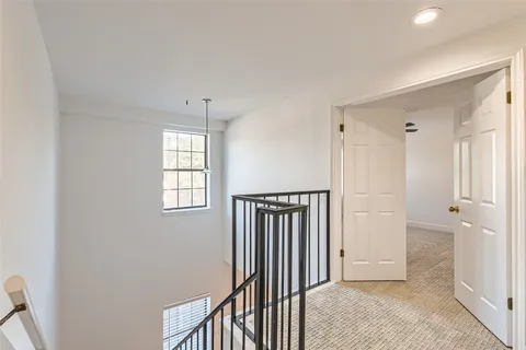 a view of a hallway with closet and entryway