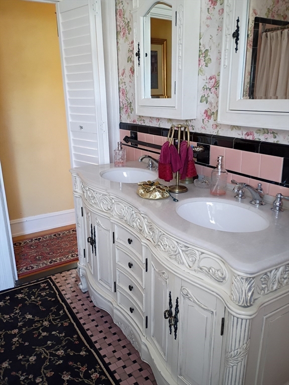 333 Langley Street Fall River, MA 02720 - Photo 31 of 42 a bathroom with a sink and a mirror