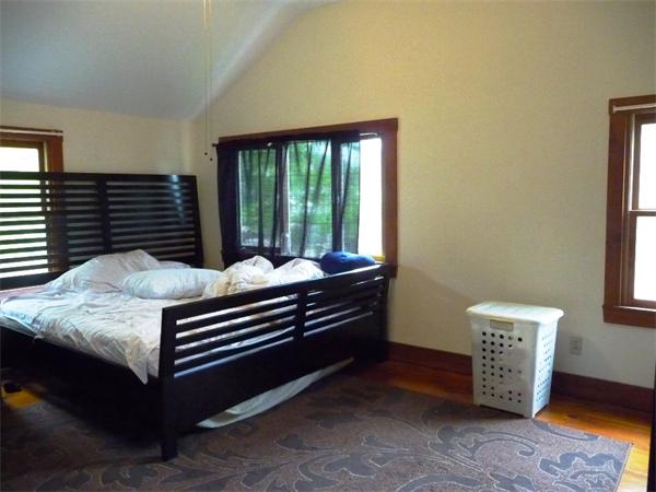 340 Bridge Road Northampton, MA 01062 - Photo 13 of 22 a bed sitting in a room next to a window