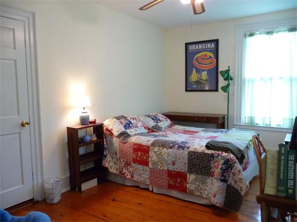 340 Bridge Road Northampton, MA 01062 - Photo 20 of 22 a bedroom with a bed and a chandelier