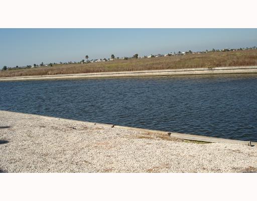 14322 Cruiser Street, Unit B Corpus Christi, TX 78418 - Photo 2 of 2 a black and white photo of a beach