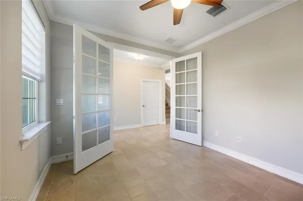 a kitchen with white cabinets appliances and a sink