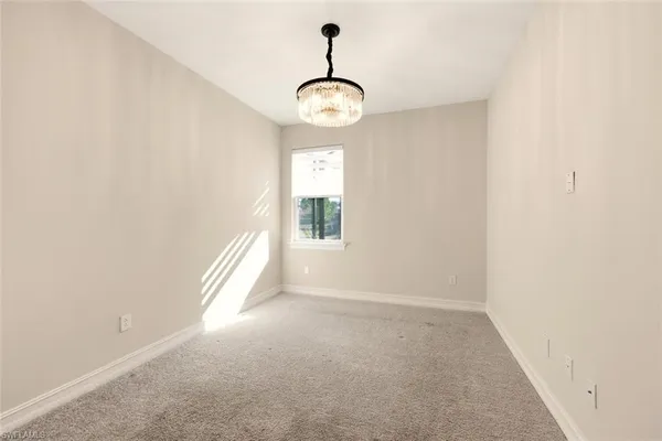 a view of room with a ceiling fan and window