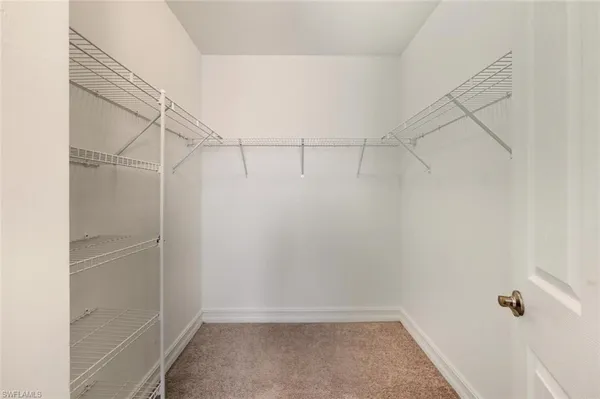 a bathroom with a granite countertop sink mirror and a bathtub