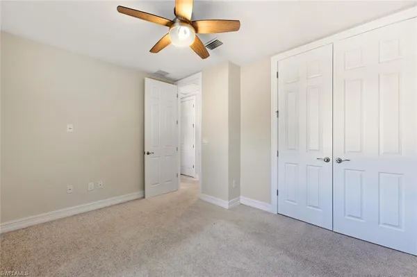 a bathroom with a bathtub shower sink mirror vanity and toilet