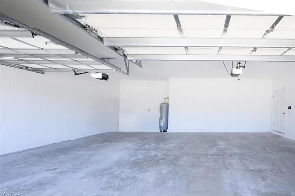 a view of a house with a yard and a porch