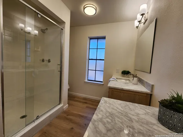 a bedroom with a bed and a mirror