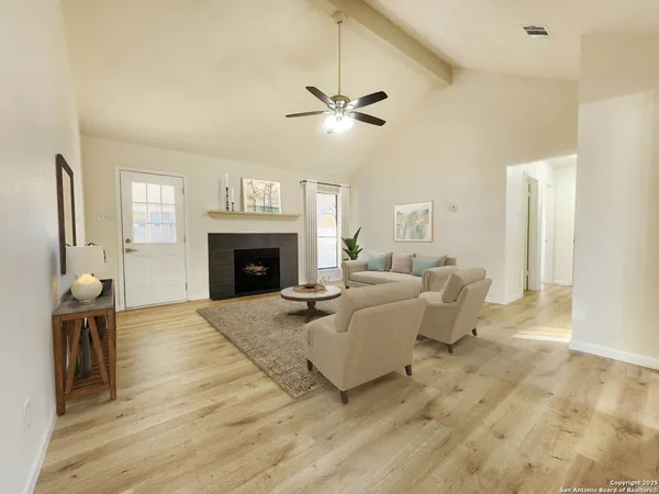 a living room with couches and a fireplace
