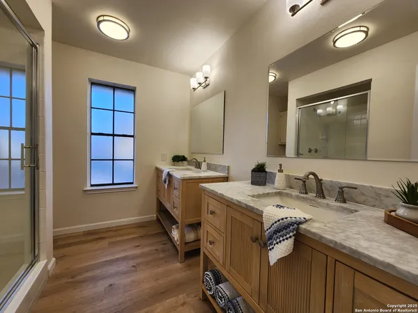 a bathroom with a granite countertop sink a mirror and a