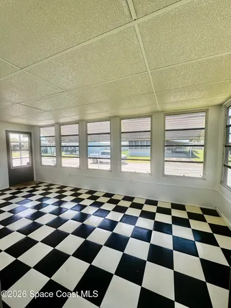 a black and white checkered floor with a black white checkered floor