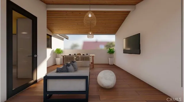 a dining room with furniture and wooden floor