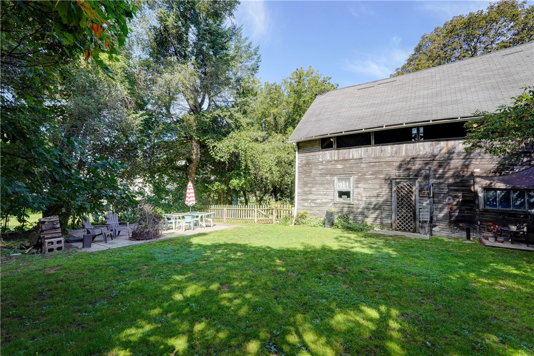 1877 Ridge Road Webster, NY 14519 - Photo 48 of 50 Backyard and back of two-story garage/outbuilding.