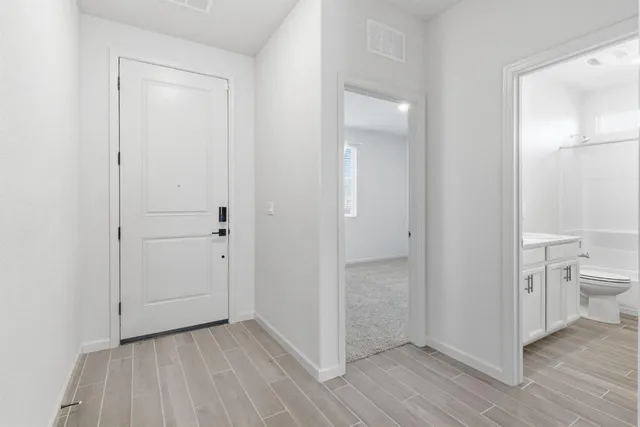 a view of a bathroom with a toilet and a shower