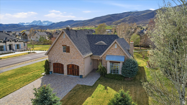 930 Price Farm Court Midway, UT 84049 - Photo 9 of 42 View of front of house featuring stone siding, a chimney, and a front yard
