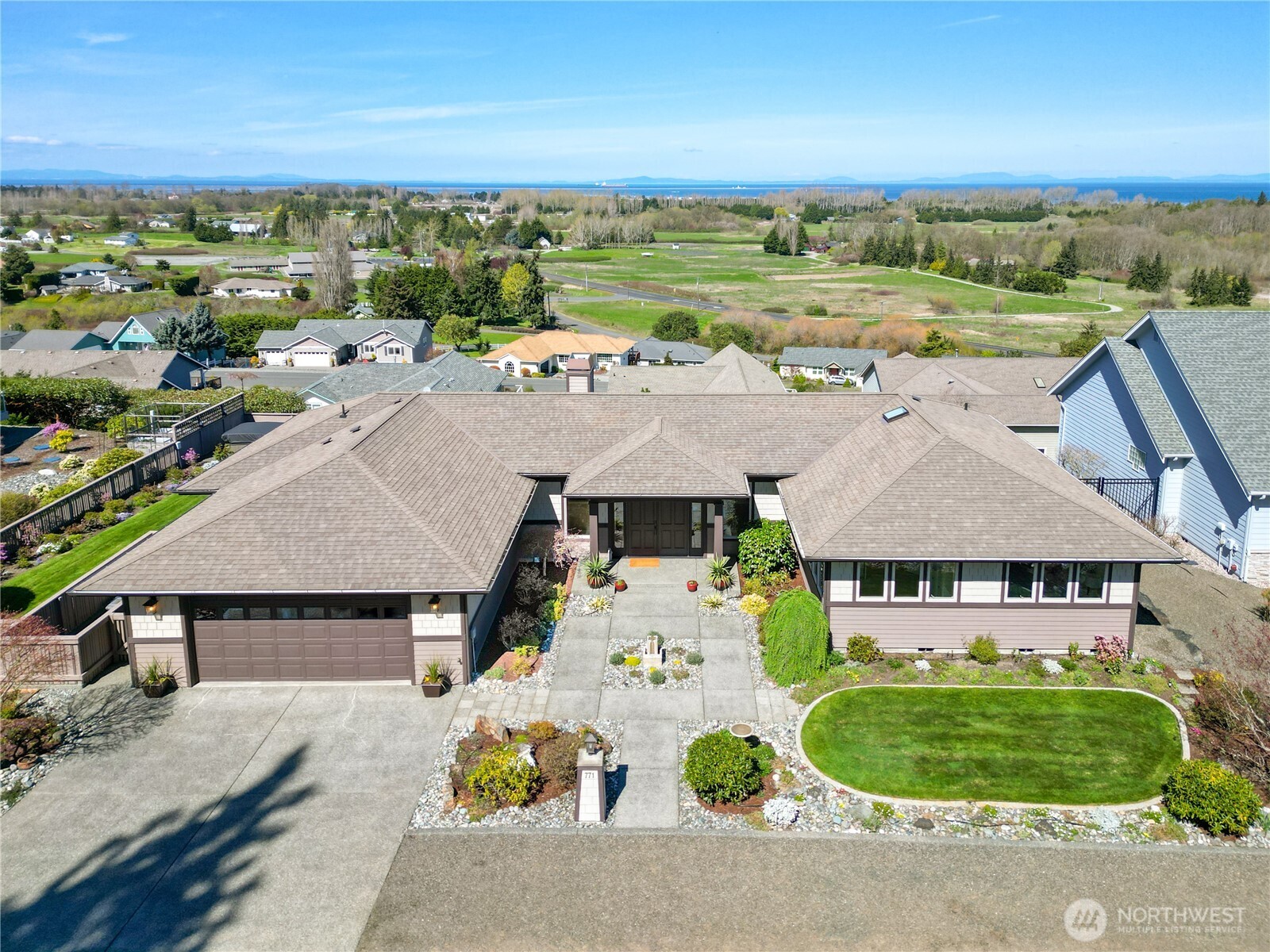 771 Brigadoon Boulevard Sequim, WA 98382 - Photo 1 of 40 an aerial view of a house with garden space and outdoor seating
